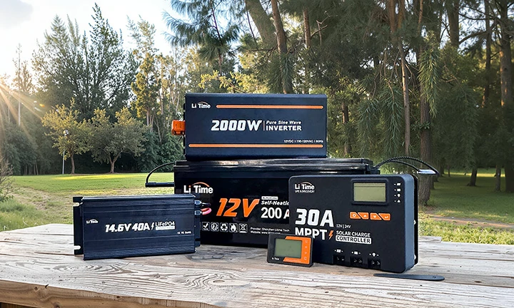 a complete LiTime off-grid power kit on a table outdoors, featuring a 200Ah battery, 2000W inverter, and MPPT charge controller
