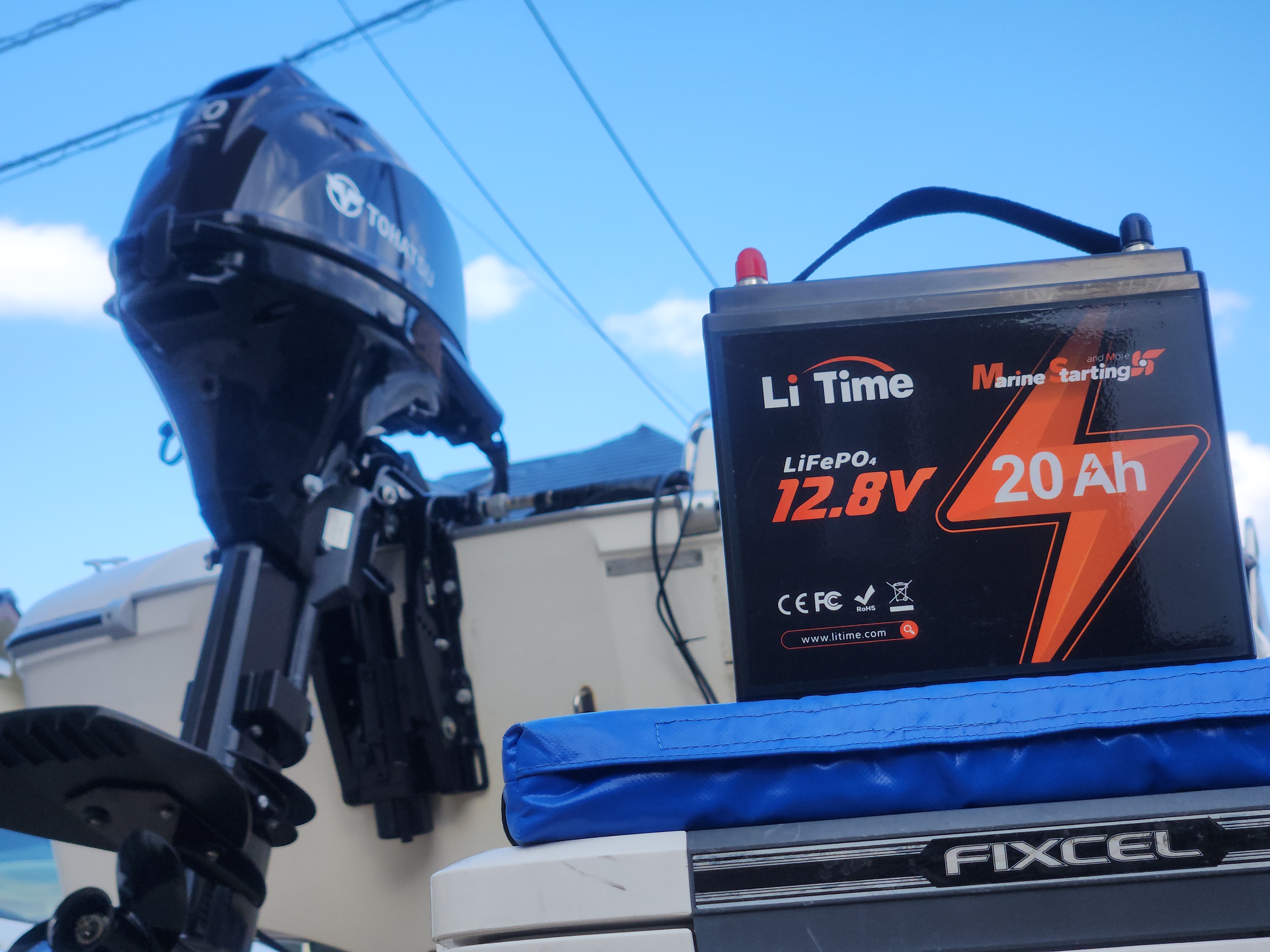 a LiTime 12V 20Ah marine starting battery by an outboard motor