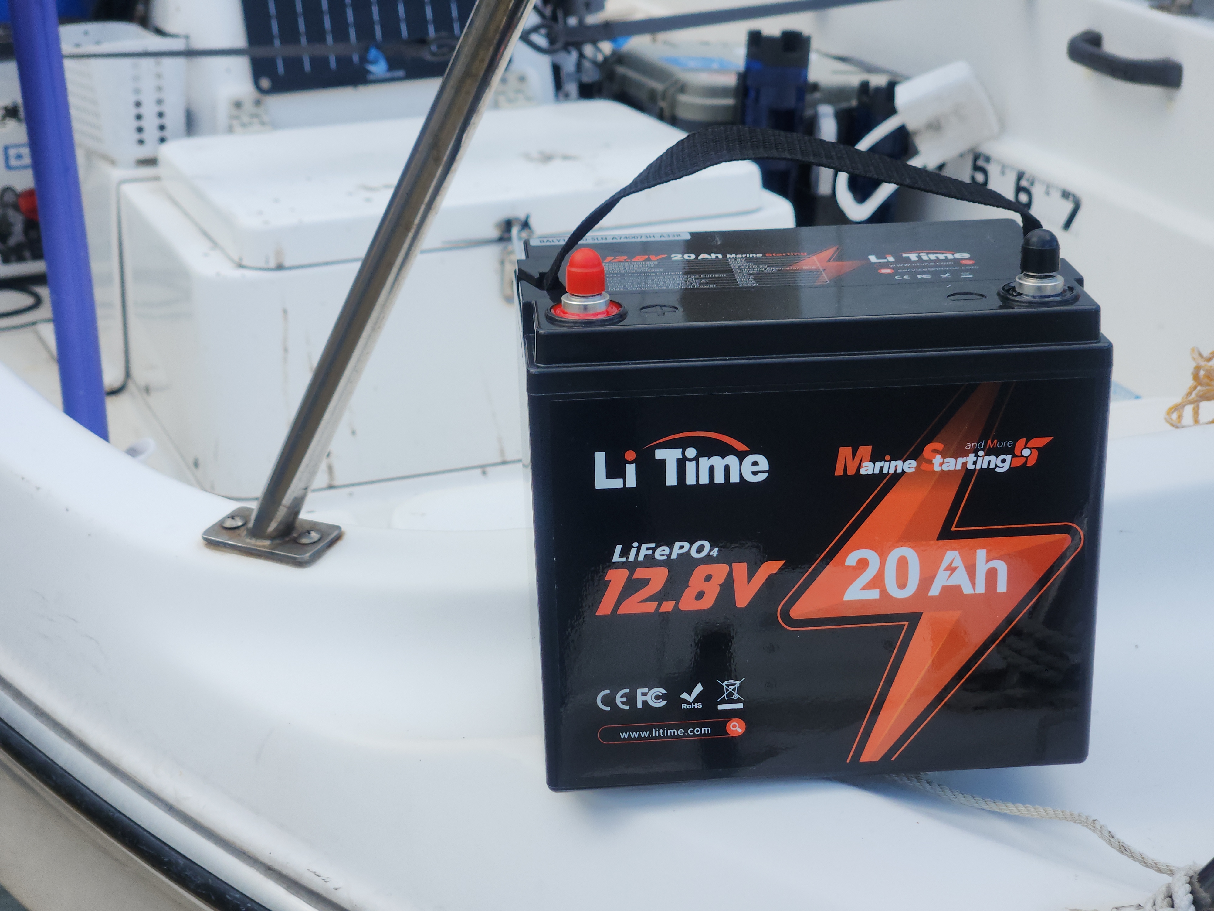 a LiTime 12V 20Ah marine starting battery placed on a boat